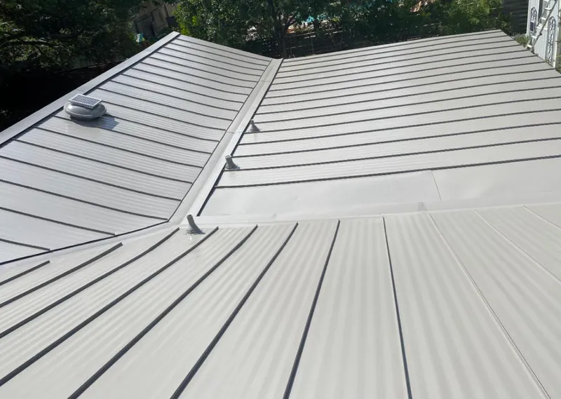 Solar attic fan installed on a metal roof for Roof Ventilation in Silver Spring
